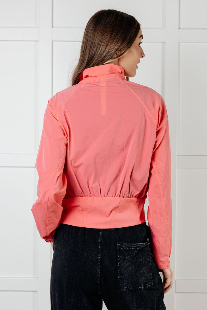 Fit Happens Nylon Tennis Jacket in Coral Rose - 1/2