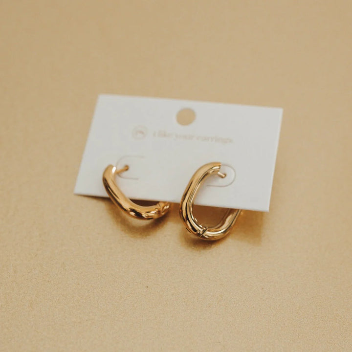 Flirty Fantasy Oval Hoop Earrings by Pretty Simple